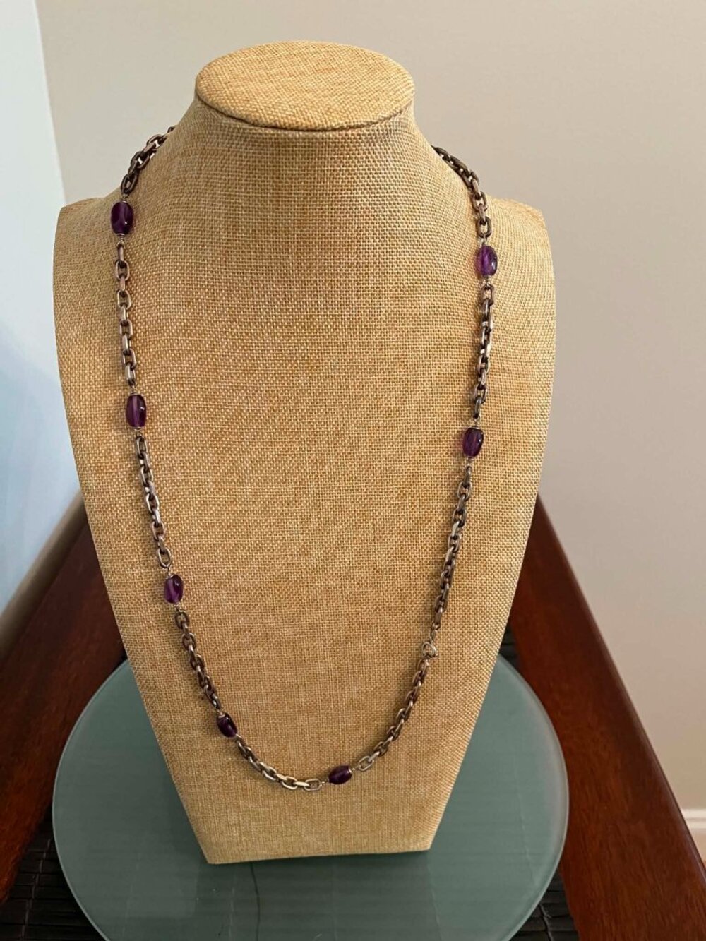 Necklace with faceted purple gemstones